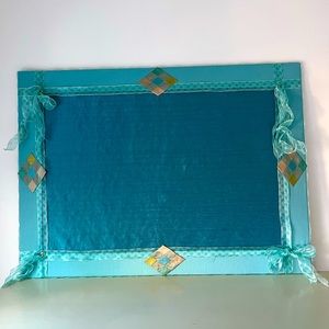 Large bulletin board custom-made in find fabric.